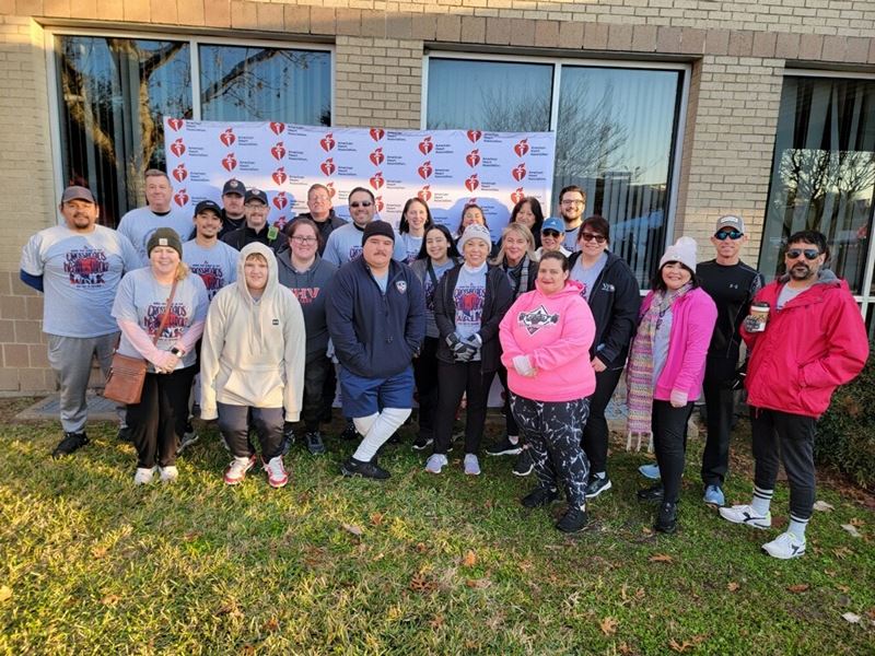 Group photo in front of American Heart Association backdrop
