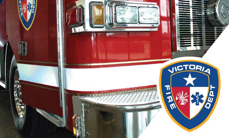 Image of fire truck with fire department logo in the foreground