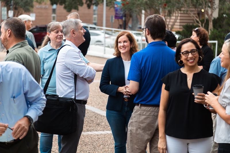 Group of people visiting in the City Hall courtyard
