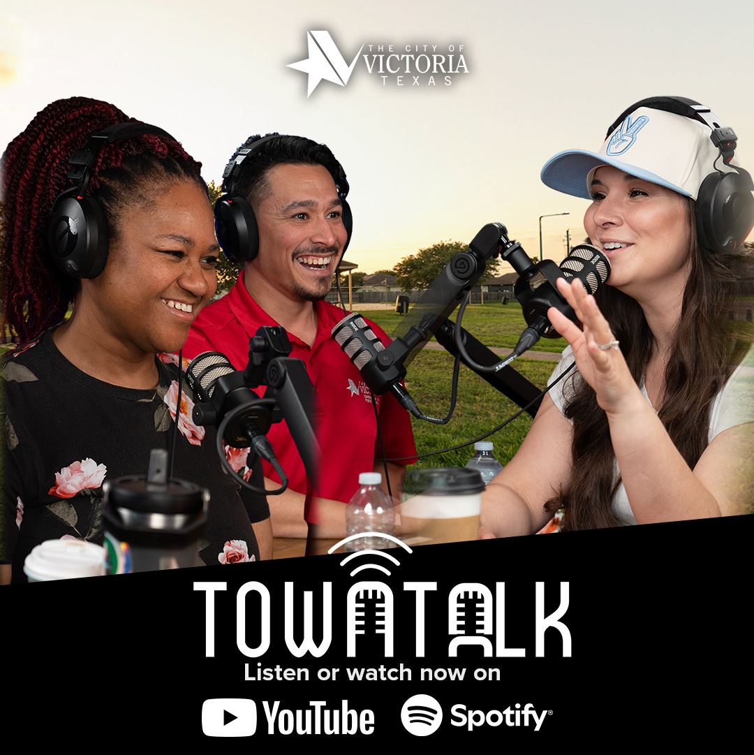 Three people in front of studio mics with Ethel Lee Tracy Park in the background