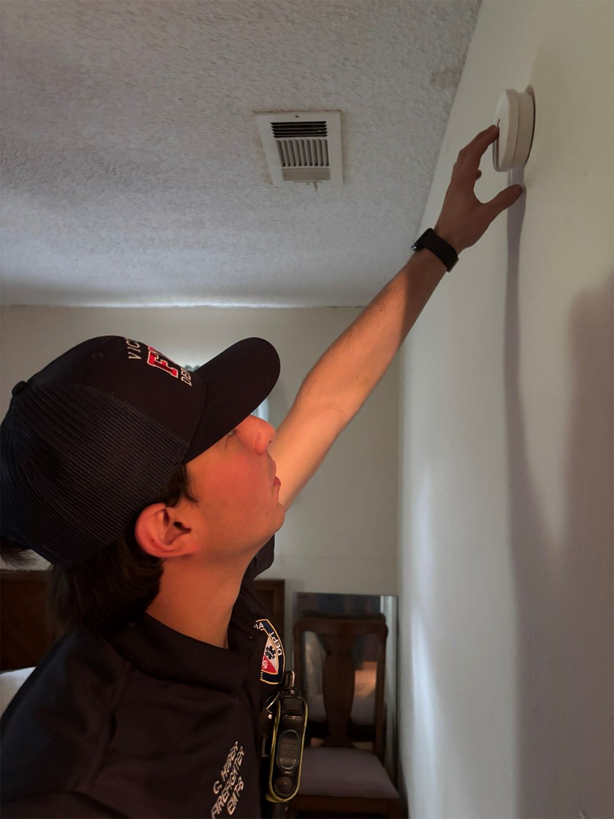 A smoke detector being tested inside of a home