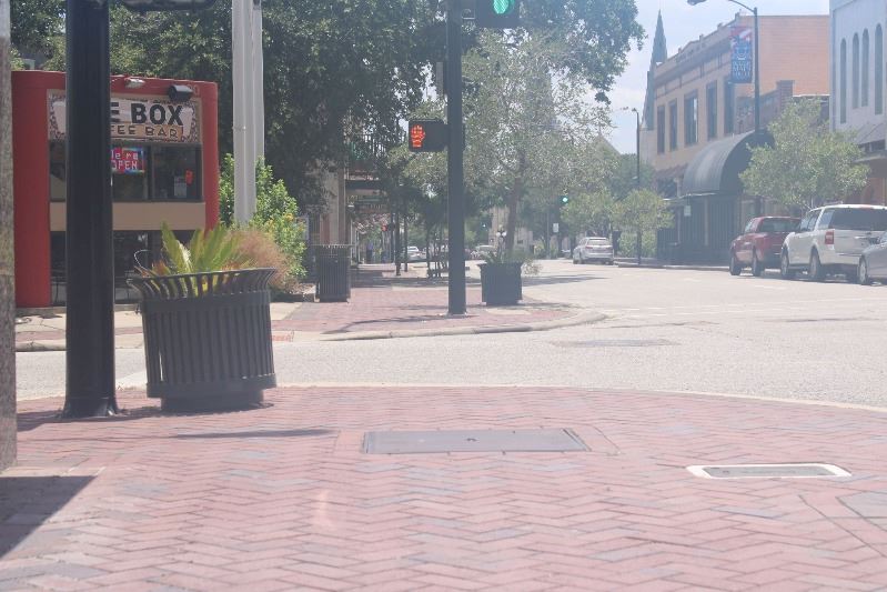 An empty sidewalk in downtown Victoria
