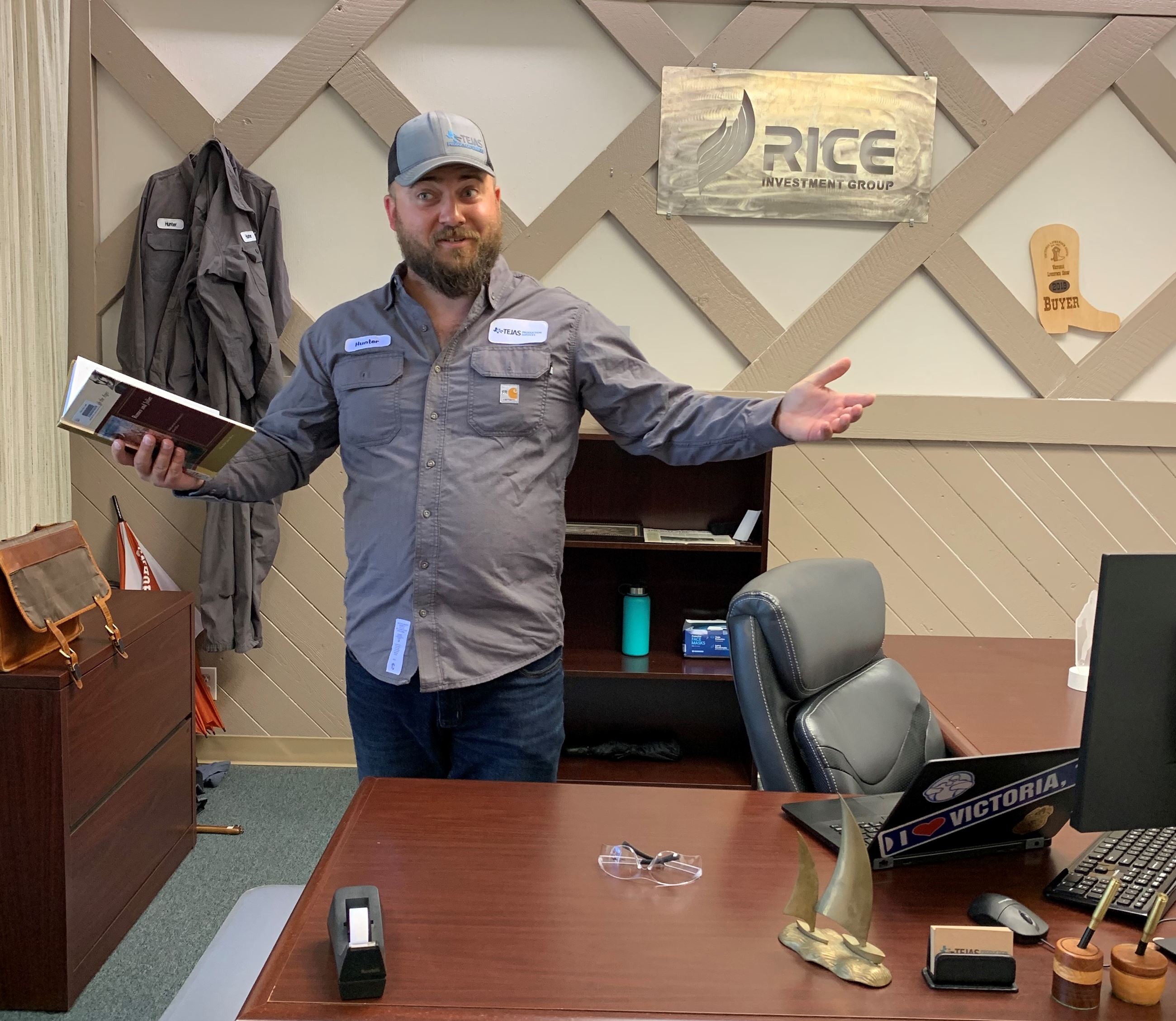 Hunter Follett, CEO of Tejas Production Services, reads aloud