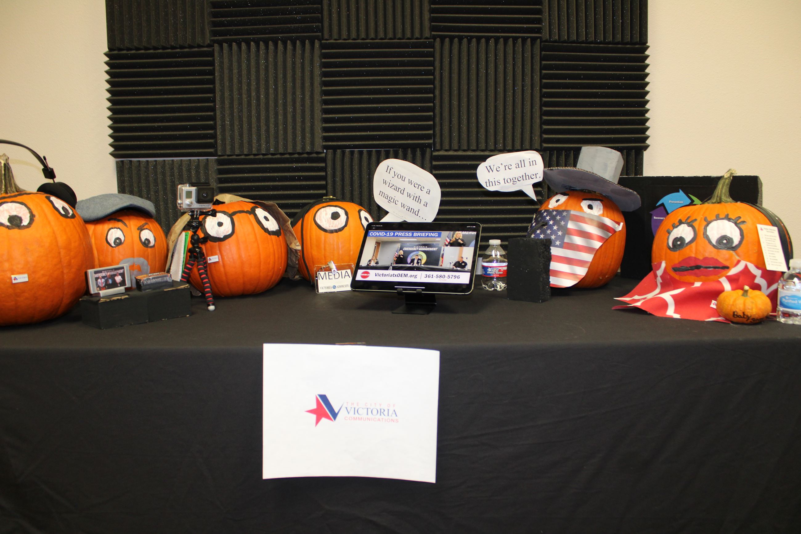 Pumpkins at a press conference dressed as mayor, Communications staff and media