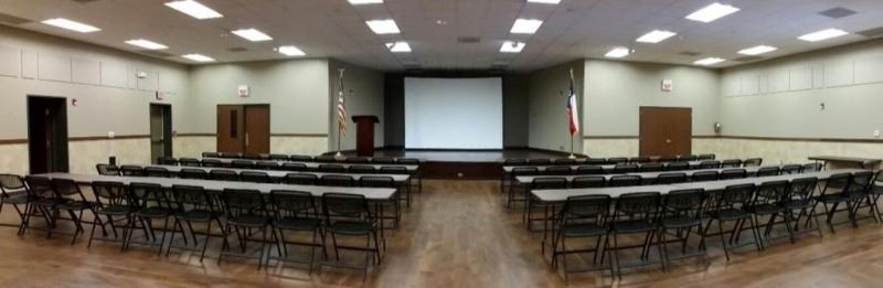 Panoramic view of Community Center stage and chairs