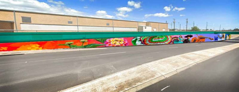 Mural featuring Mexican marigolds and other flowers, dancers in Mexican dresses and a violin