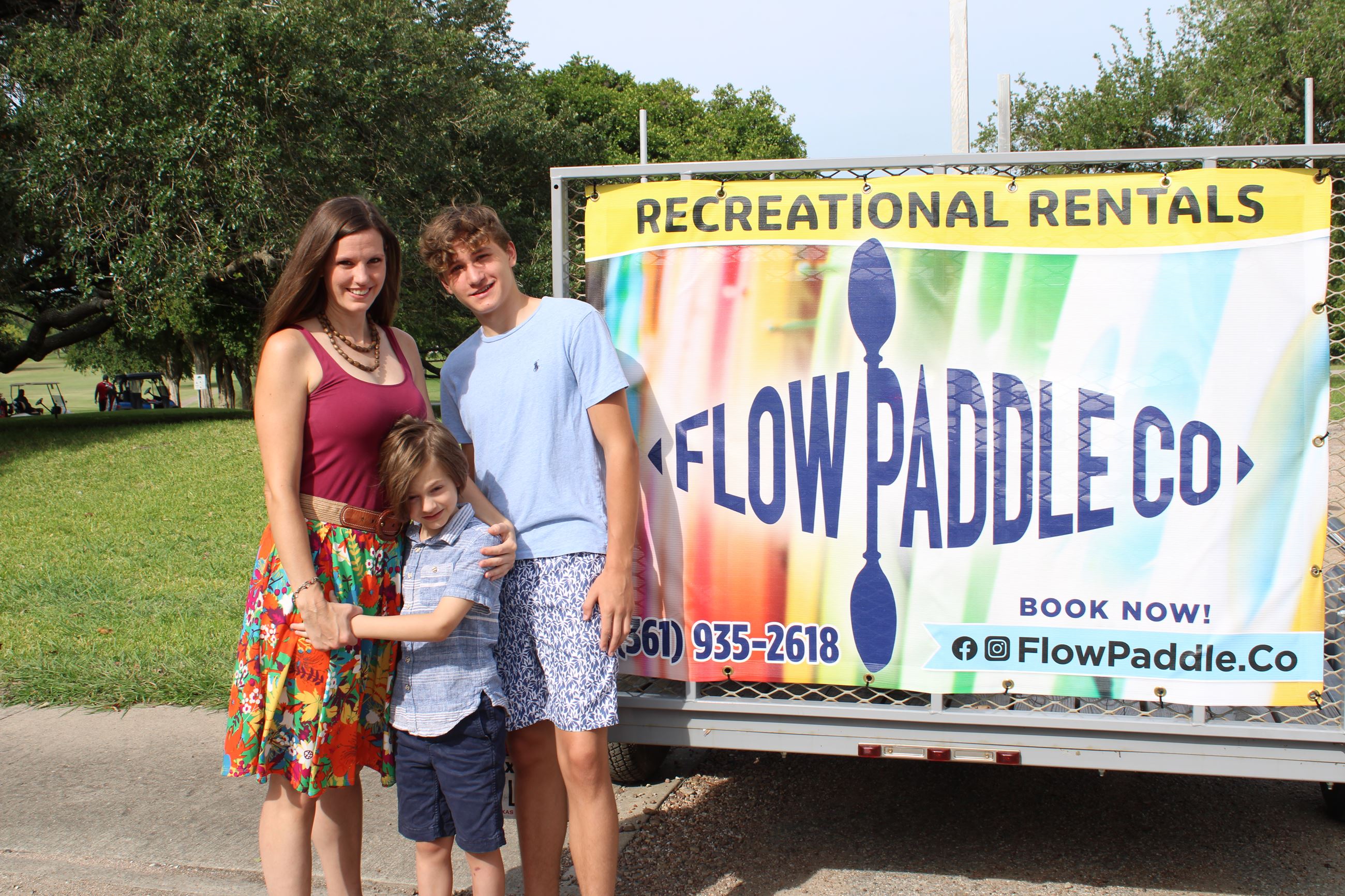 Ashley and two sons with kayak trailer