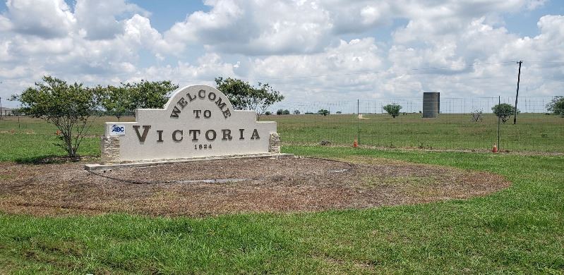 Welcome to Victoria sign with vegetation cleared away