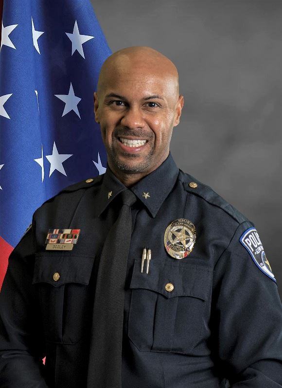 Vernell Dooley Jr. in police uniform