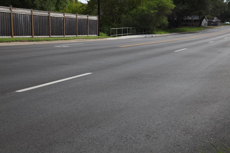 Airline Road is newly paved with dark asphalt and new striping.